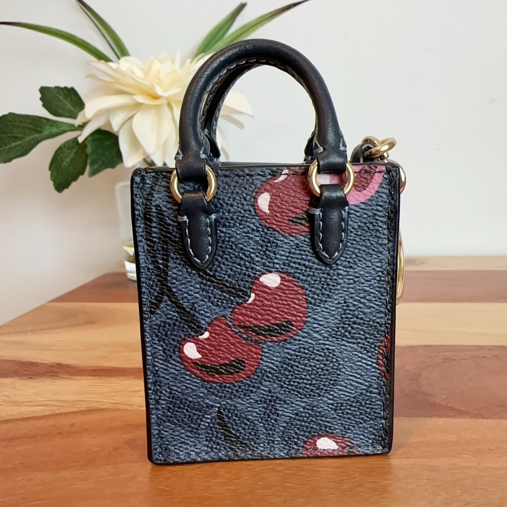 NWT Coach North /South Mini Tote Bag Charm In Signature Canvas With Cherry Print - Picture 3 of 5